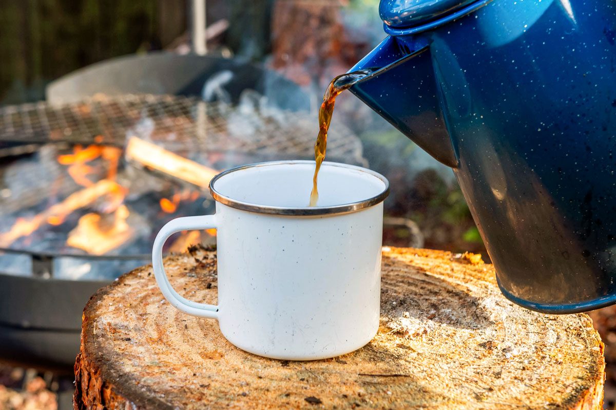 Cowboy coffee made outdoors over wood fire