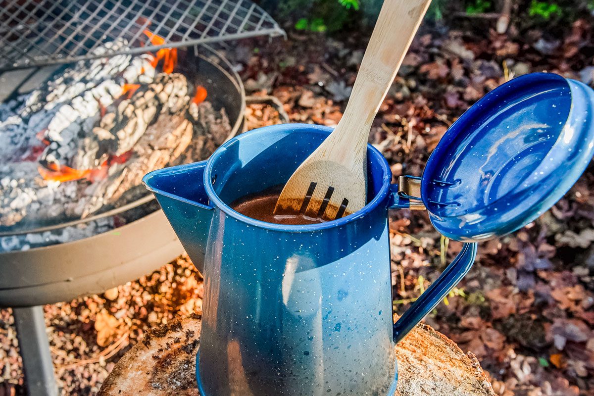 Cowboy coffee made outdoors over wood fire