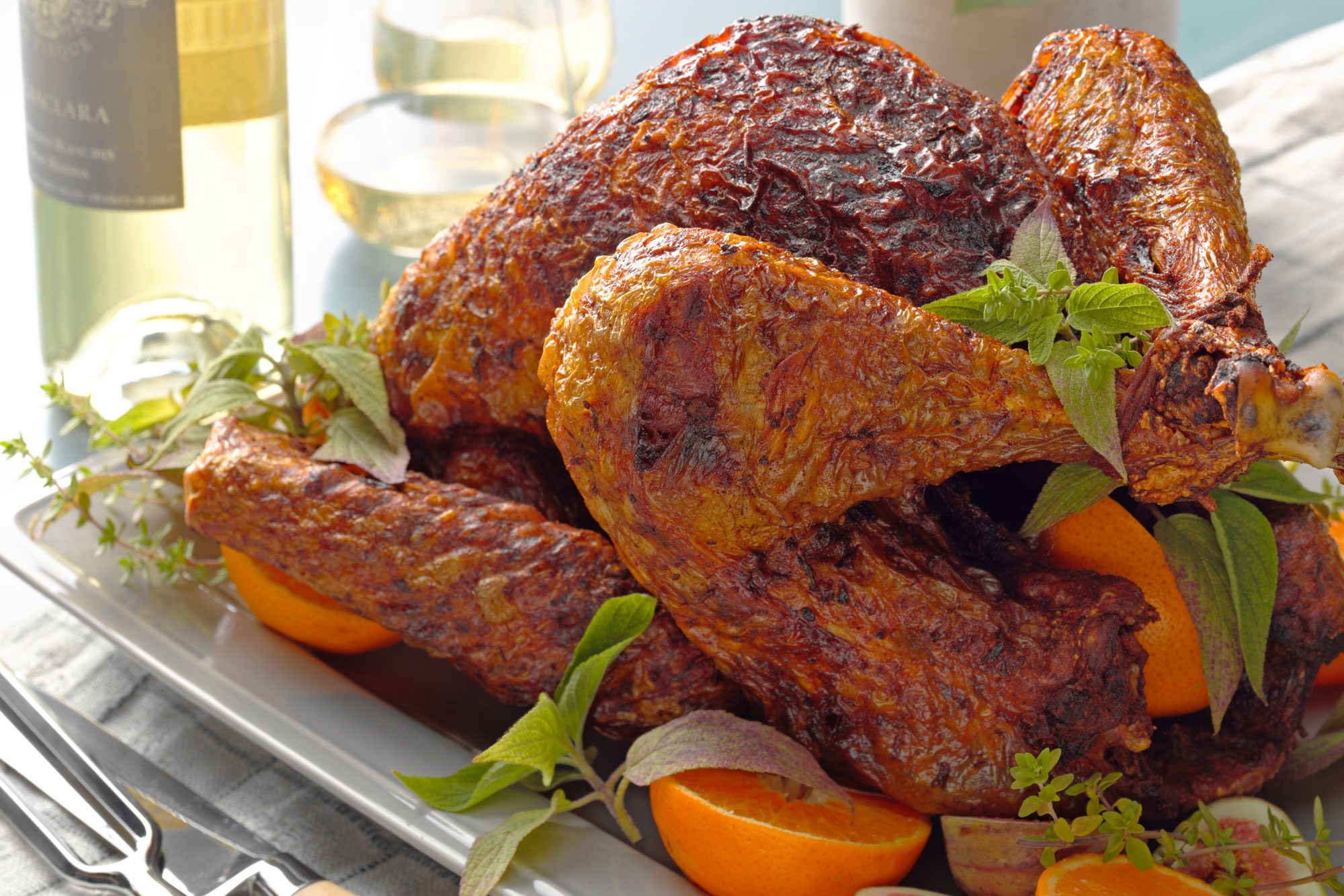 Deep Fried Turkey on a plate, accompanied by a knife and fork