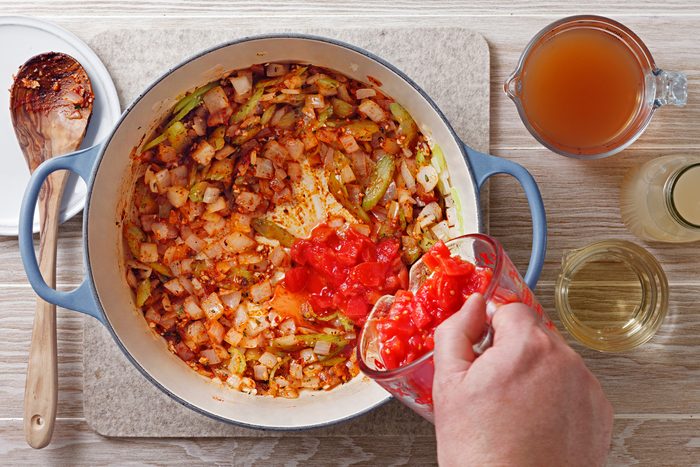 Stir in the diced tomatoes, clam juice, vegetable broth and white wine