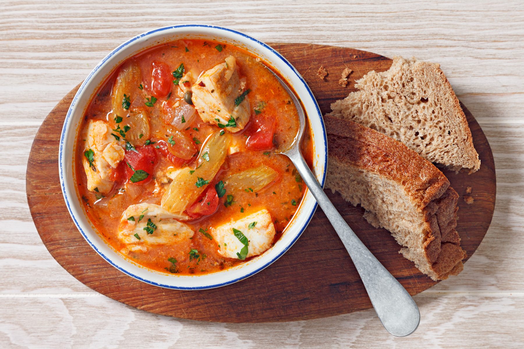 overhead shot of fish stew in a dutch oven