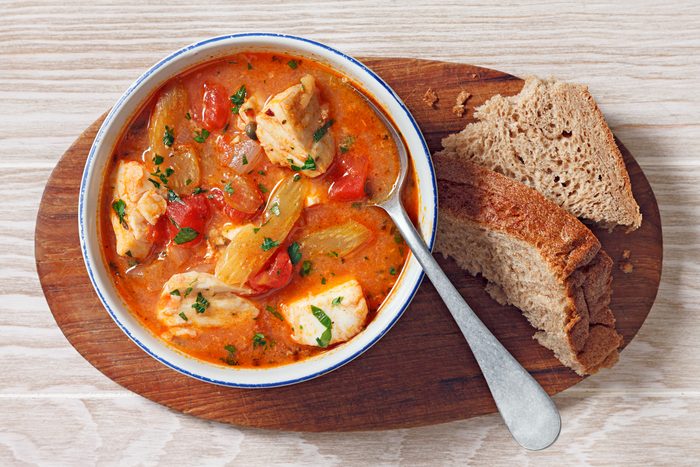 overhead shot of fish stew in a dutch oven