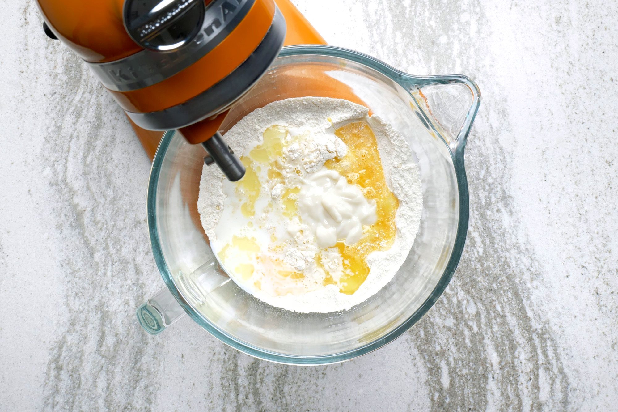 In the bowl of a stand mixer, combine the bread flour, milk powder, sugar, salt and yeast and mix well