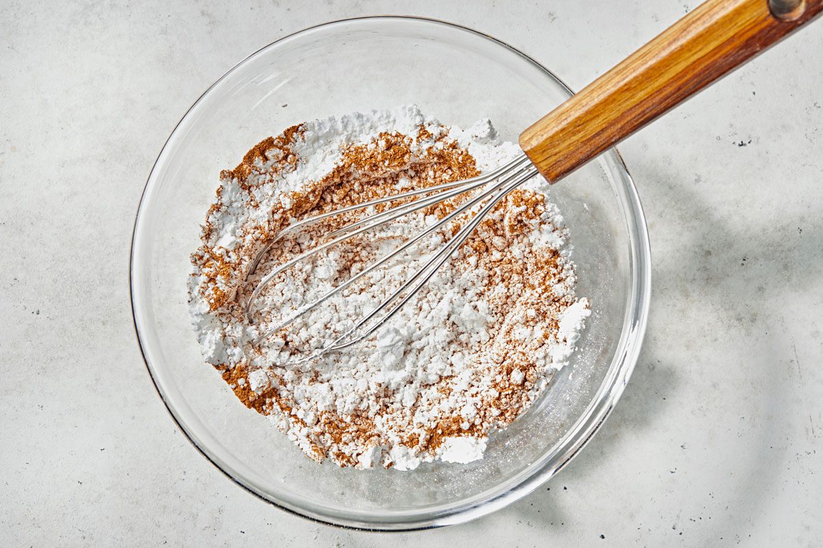 In a shallow bowl mix confectioners sugar and remaining cinnamon