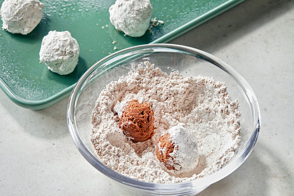 Shape dough into 1and 1 half inch balls; roll in confectioners sugar mixture