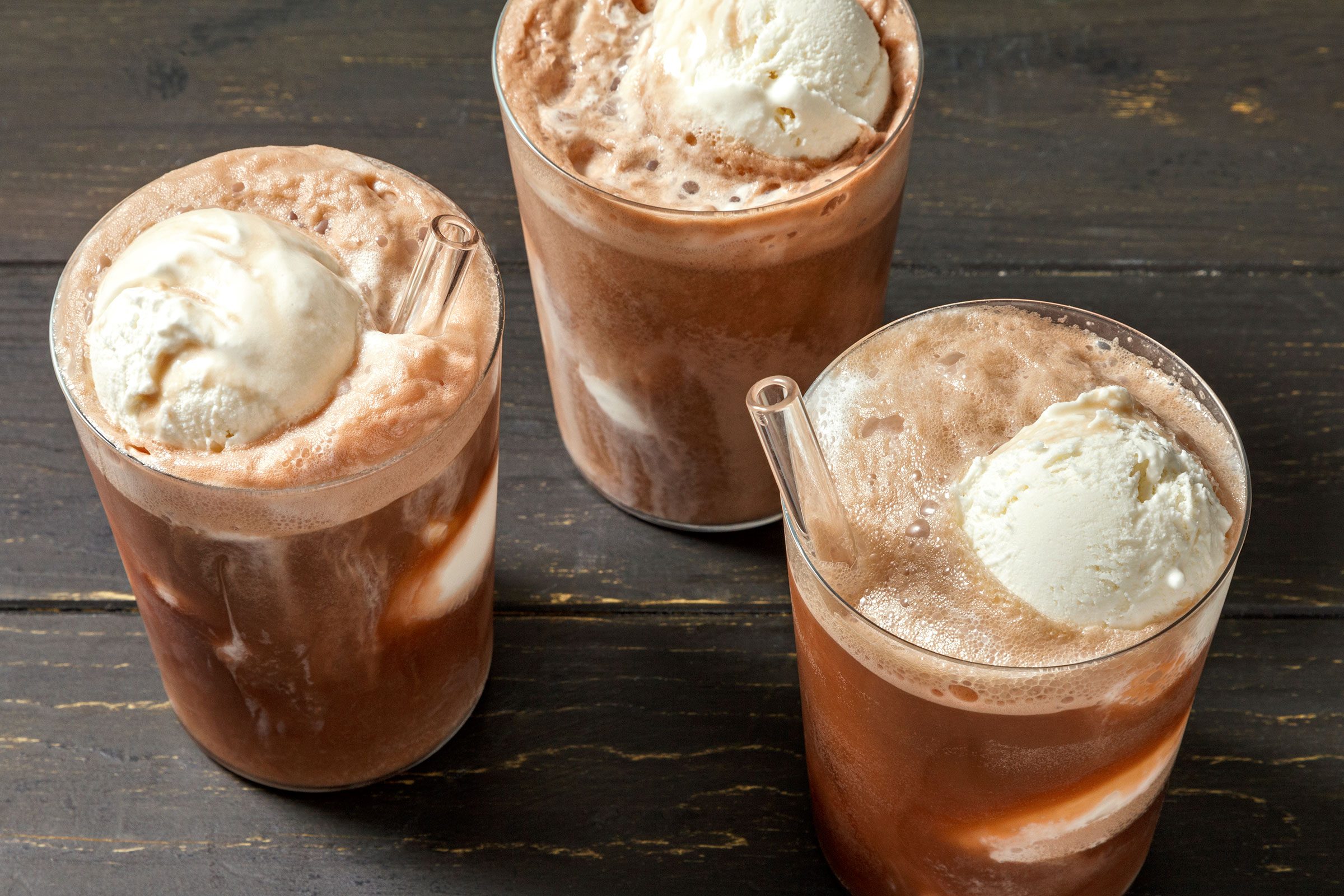 Root Beer Float served in three glasses with ice cream in them
