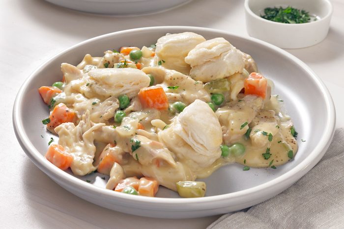 Slow Cooker Chicken And Dumplings served on a white plate