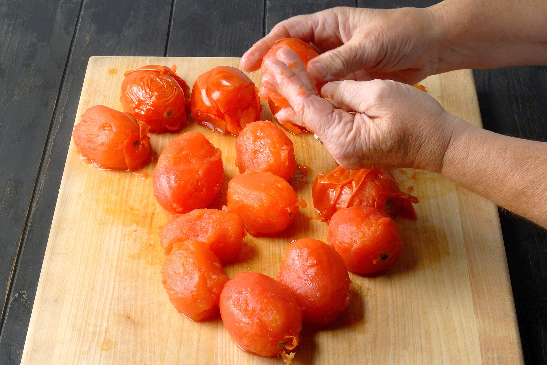 Peel skins from the tomatoes; discard skins.