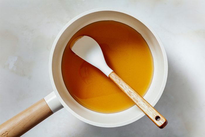 In a small saucepan, combine water and sugars.