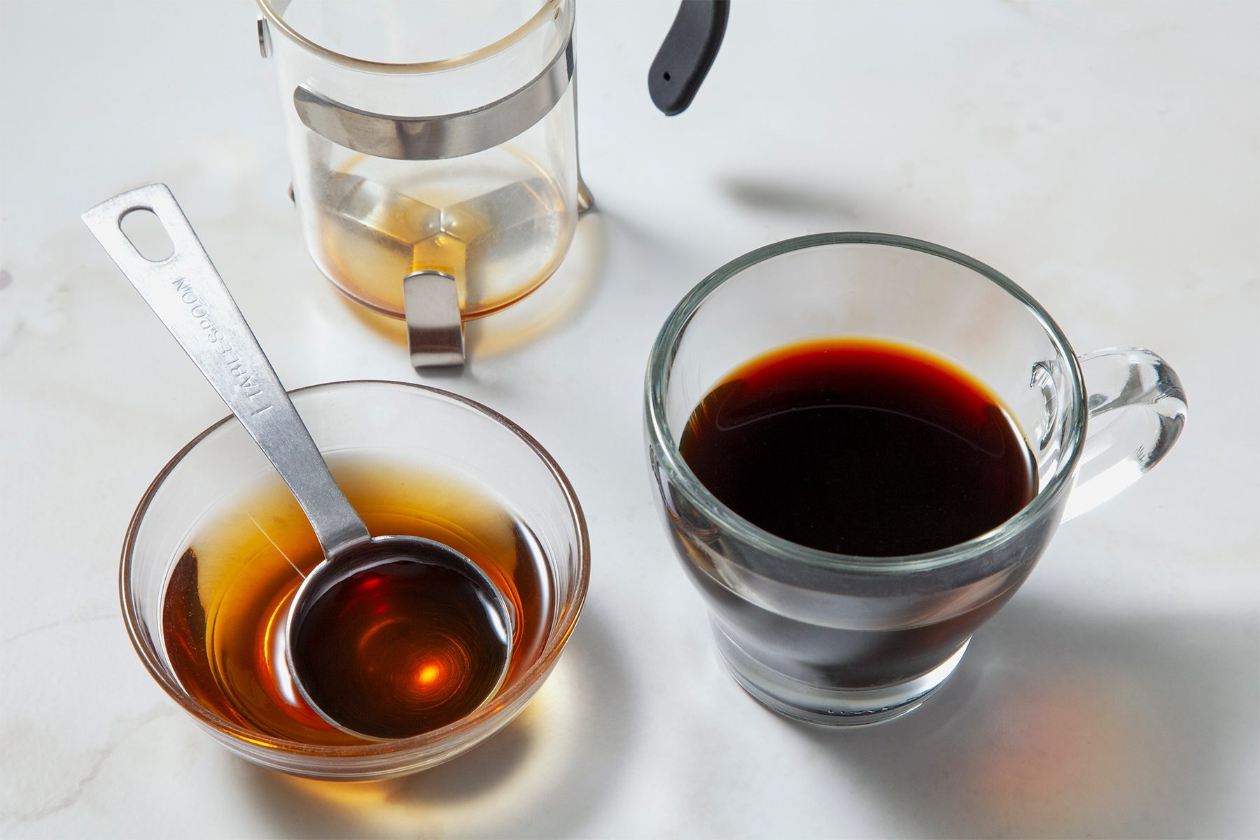 Add reserved 2 tablespoons syrup and espresso into a mug, stir to combine.