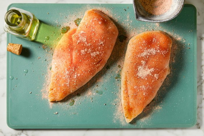 Drizzle chicken breasts with olive oil. Season with herb and spice rub on all sides.
