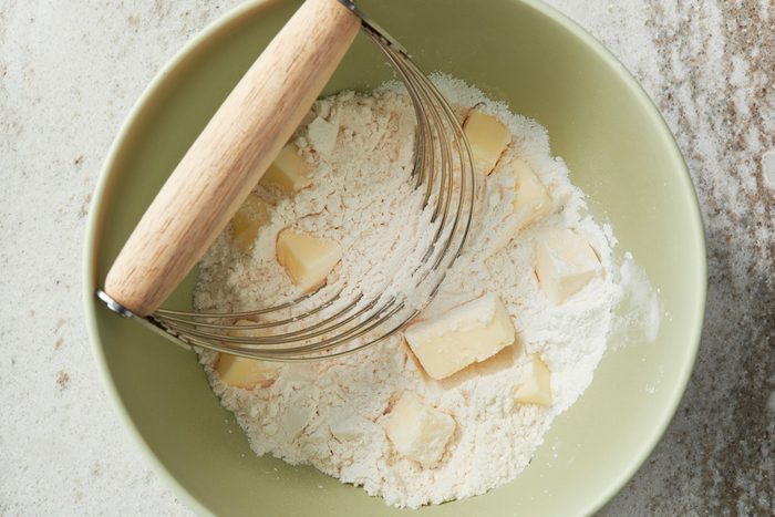 In a bowl combine baking powder and remaining flour and salt; Cut in 3 tablespoons butter