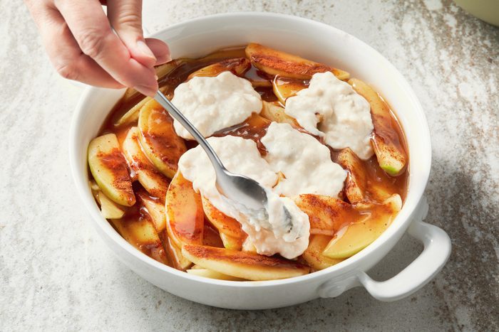 Drop douigh by spoonfuls over sauce