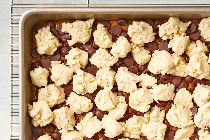 teaspoonful dough dropped over the top of the chocolate caramel filling