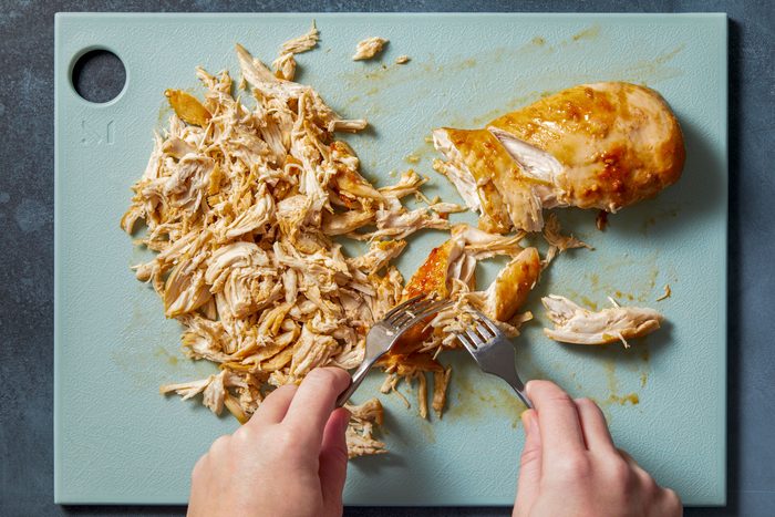 shred chicken with 2 forks and refrigerate until assembly.