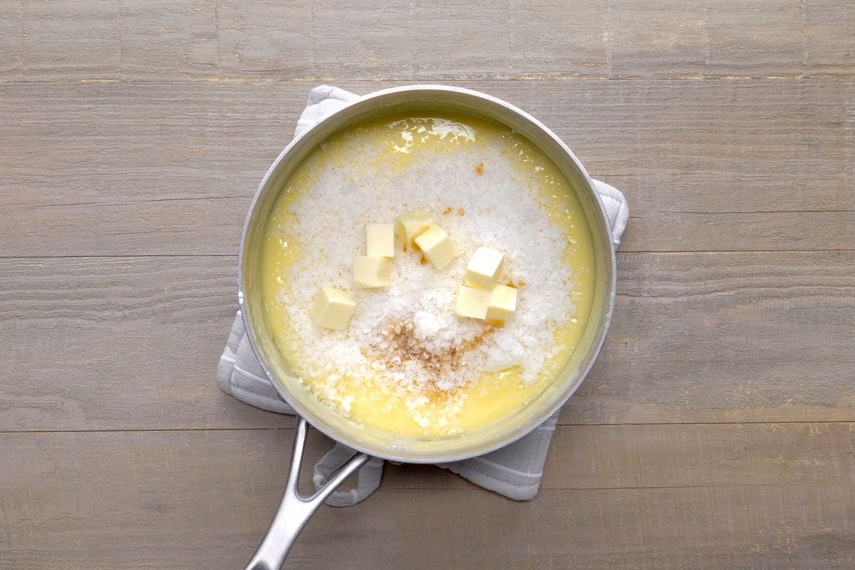 Gently stir in chopped coconut, butter and vanilla until butter is melted.