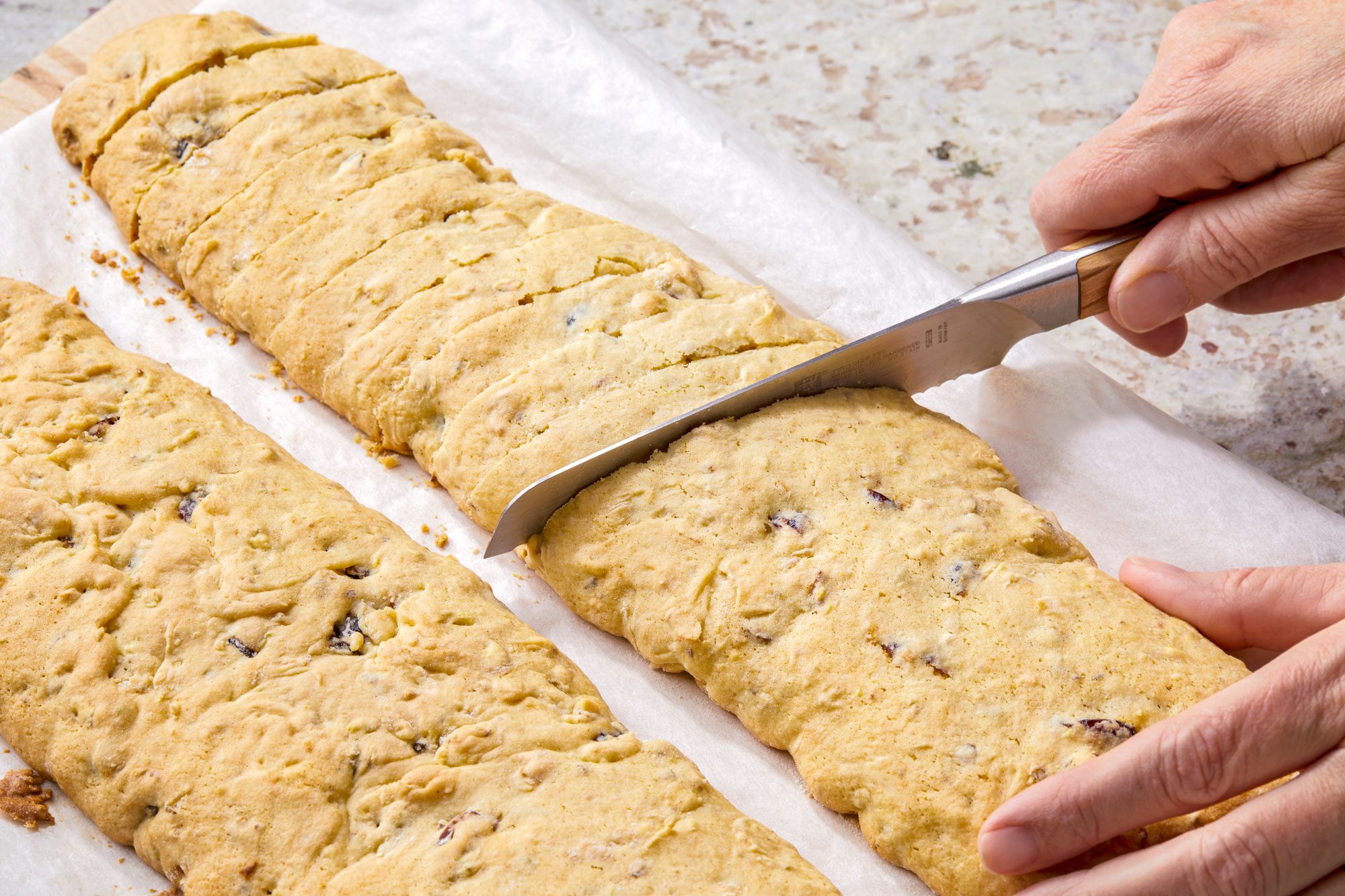 Place pan on wire rack; When cool enough to handle; transfer to a cutting board; cut diagonally with a serrated knife into 3/4-inch slices; knife