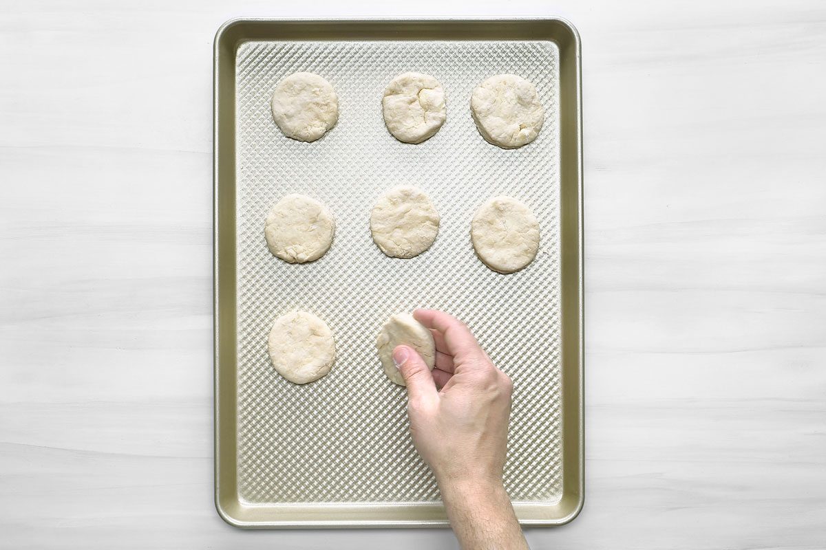 Overhead shot of place 1 inch apart on an ungreased baking sheet; Bake until golden brown 10-15 minutes; serve warm; wooden surface