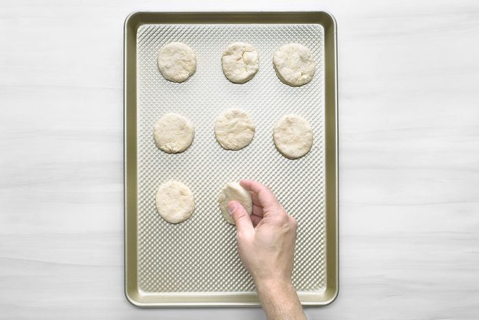 Overhead shot of place 1 inch apart on an ungreased baking sheet; Bake until golden brown 10-15 minutes; serve warm; wooden surface