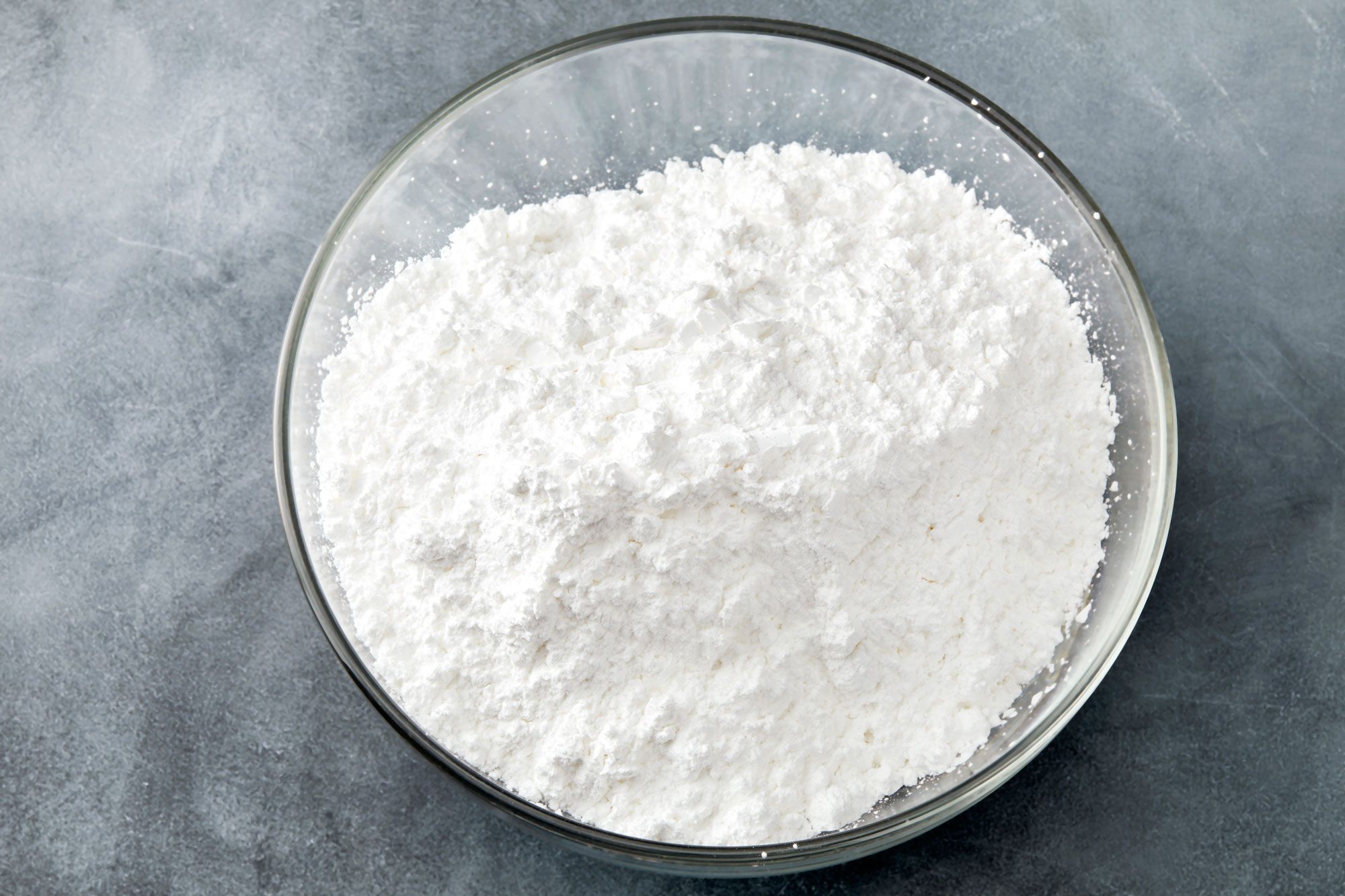 In a large bowl combine the flour; confectioners sugar and baking powder