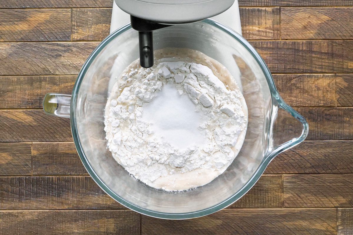 milk, salt, egg, oil, flour, water and sugar mixed in a large bowl