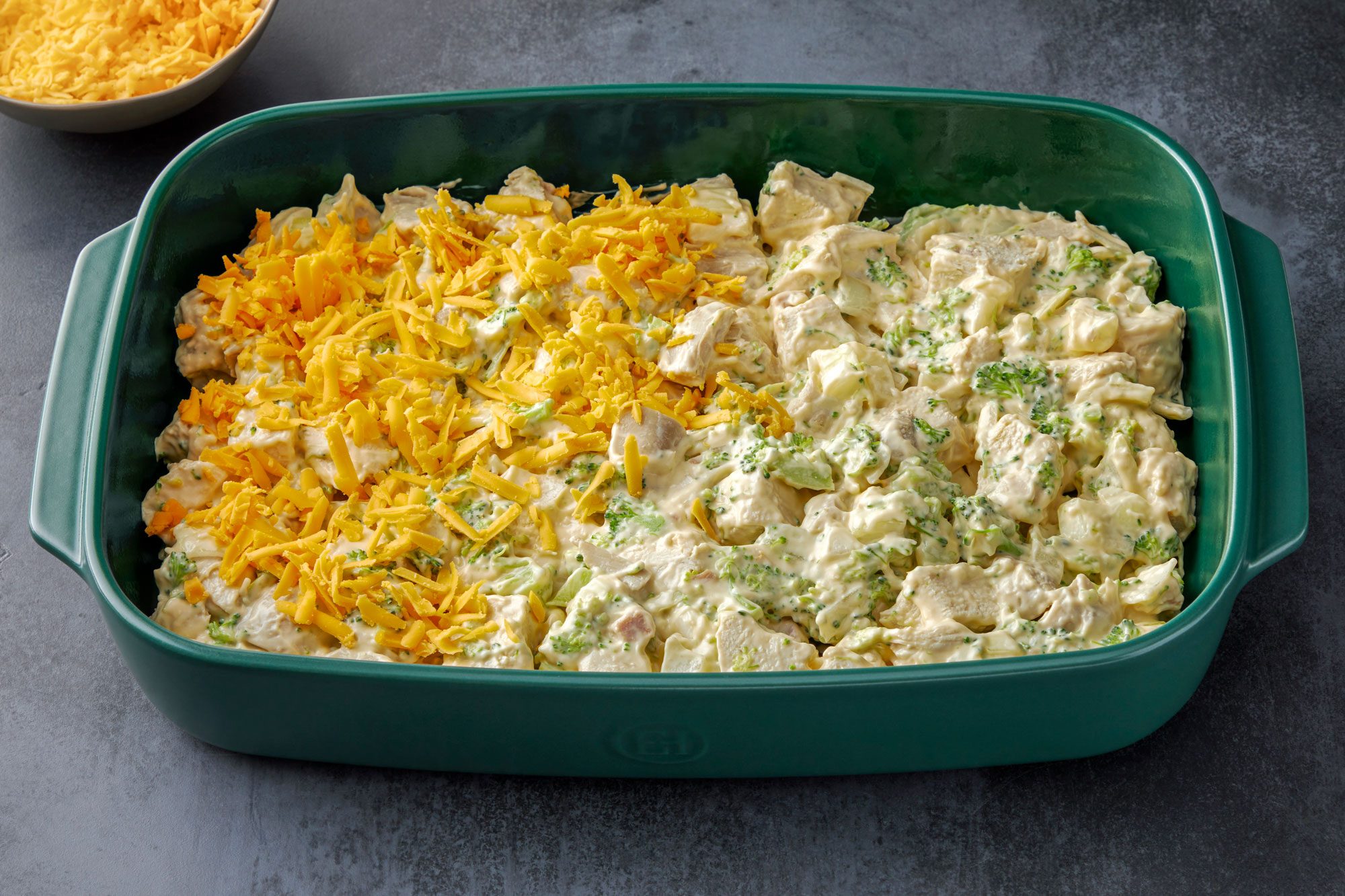 Transfer to a greased 13x9-in. baking dish. Sprinkle with cheese. Cover and bake at 375° for 20 minutes.