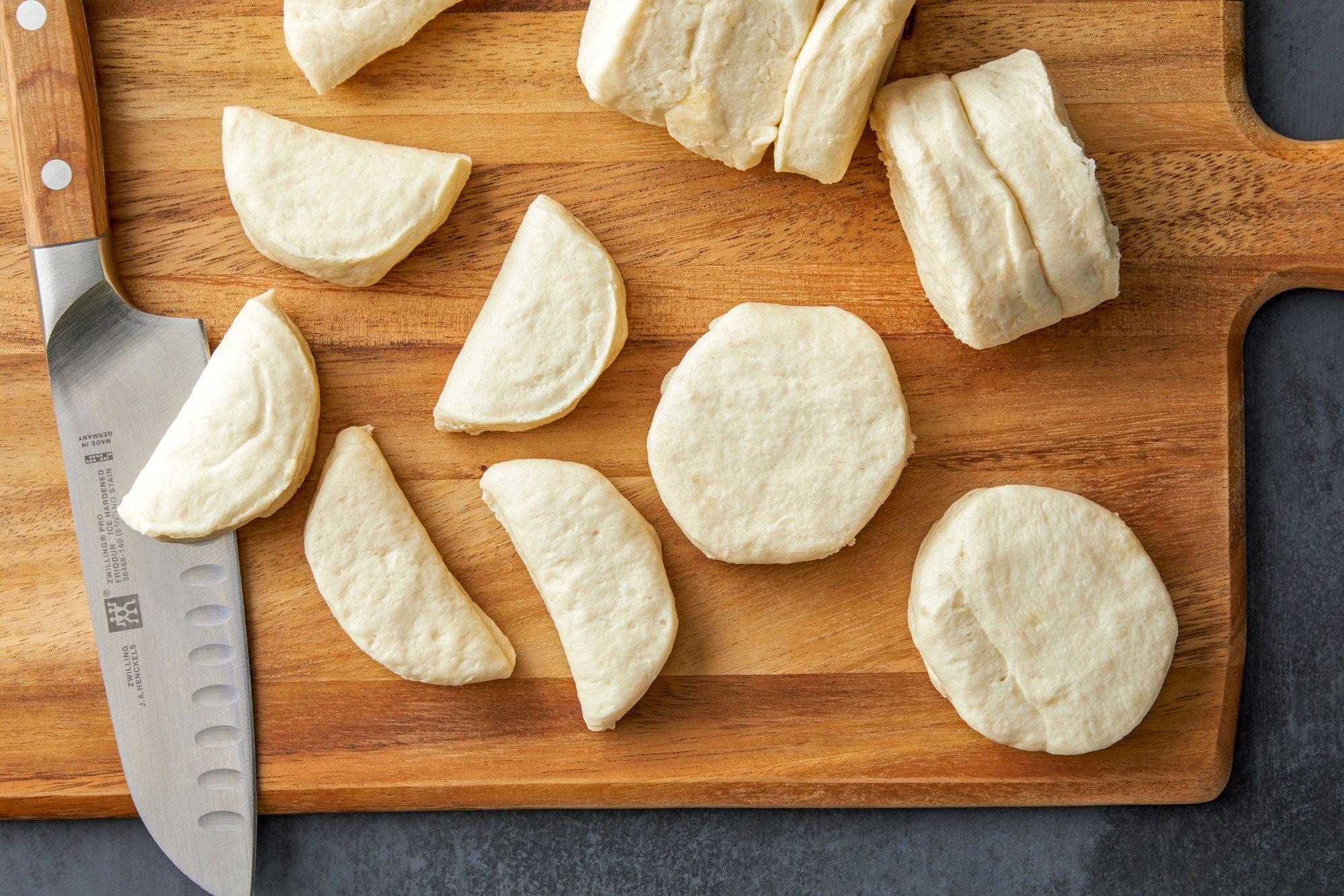 Separate biscuits; cut each in half.