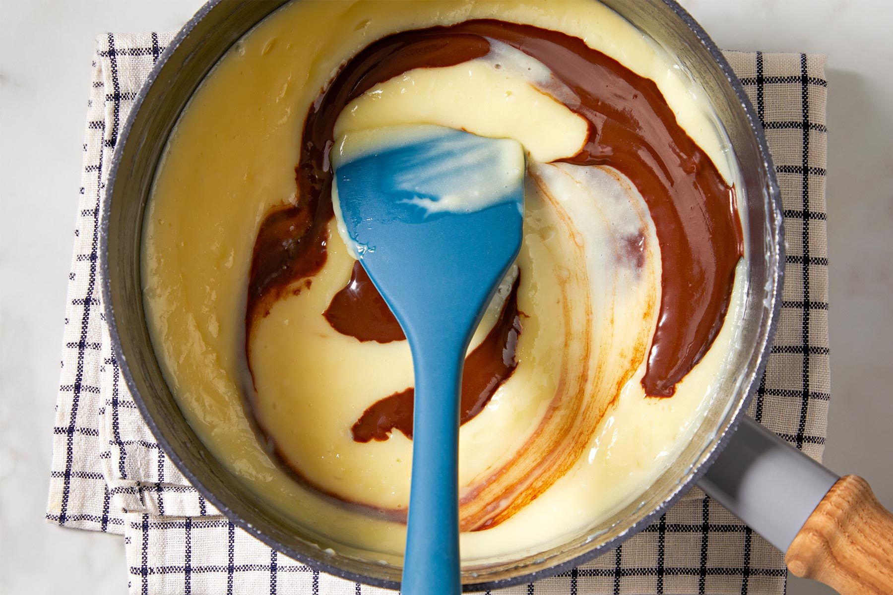 Stir in chocolate mixture into the egg mixture with a spatula.