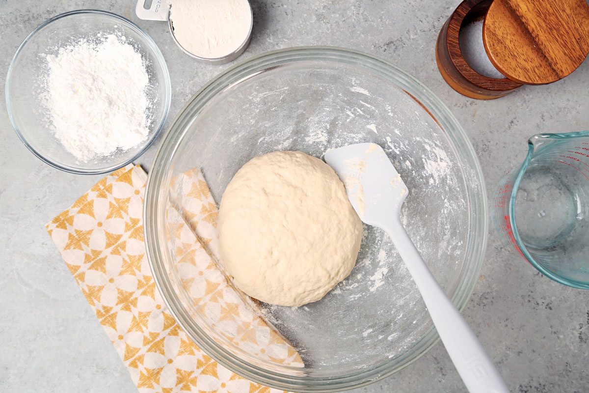 Dough made and resting in a large bowl.