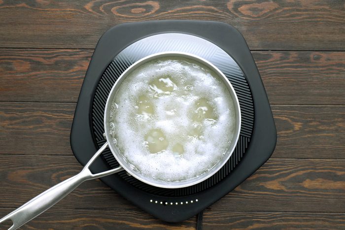 A saucepan of boiling water for potatoes