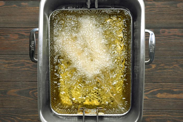 Frying the corn dogs in hot oil