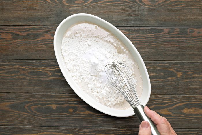 Flour and salt in yeast mixture