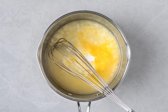 In a large heavy saucepan, mix sugar and cornstarch. Whisk in lemon juice and zest.
