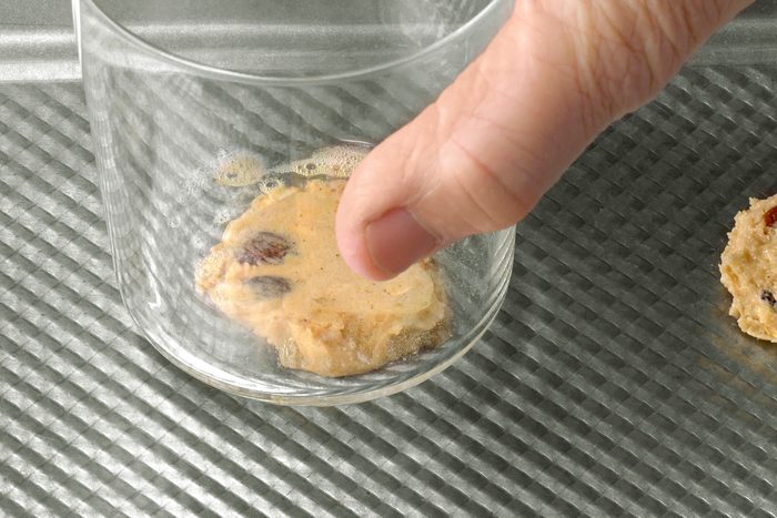 Close shot of flatten with a greased glass bottom; bake at 350 degree until golden brown 10-11 minutes; Do not overbake;