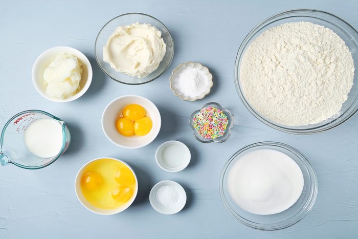 sugar, eggs, cheese, almond extract, flour, baking powder, salt, milk and sprinkles.