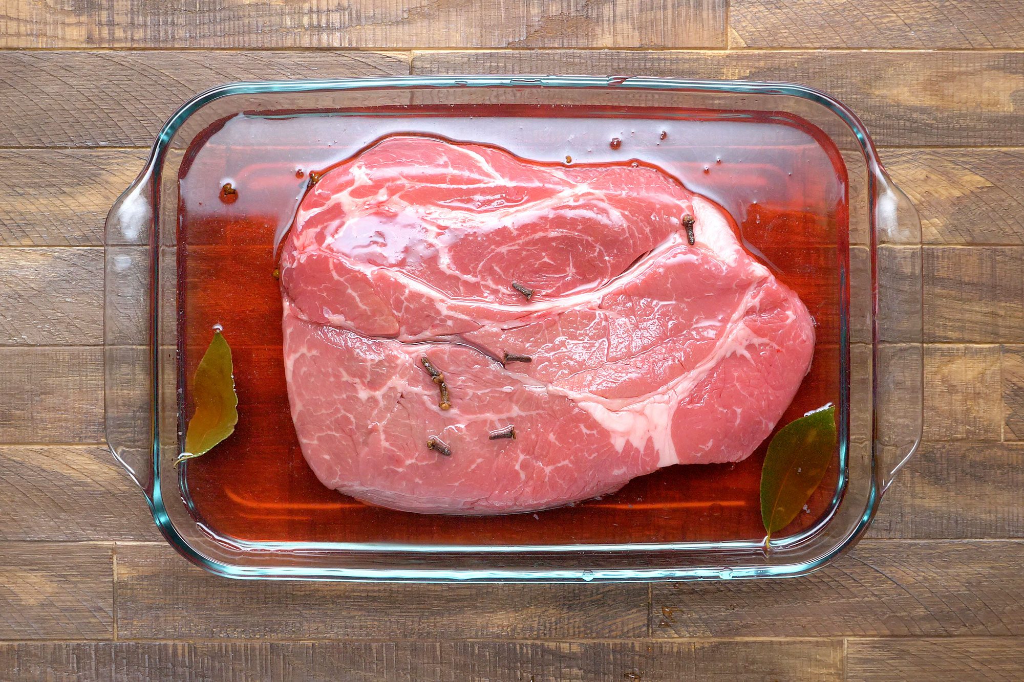 Add roast to large bowl with remaining marinade; turn to coat
