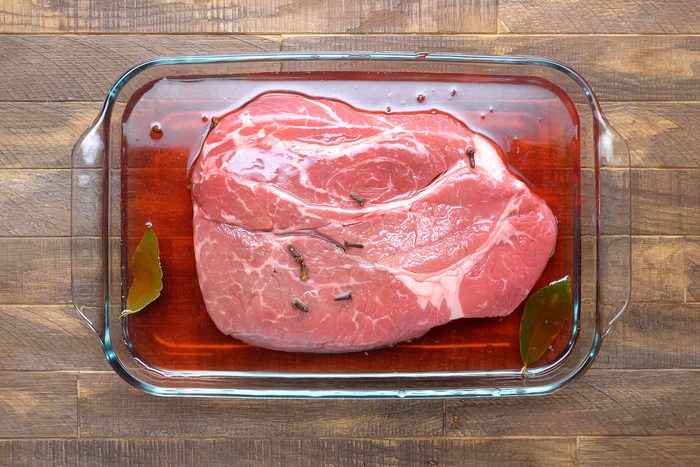 Add roast to large bowl with remaining marinade; turn to coat