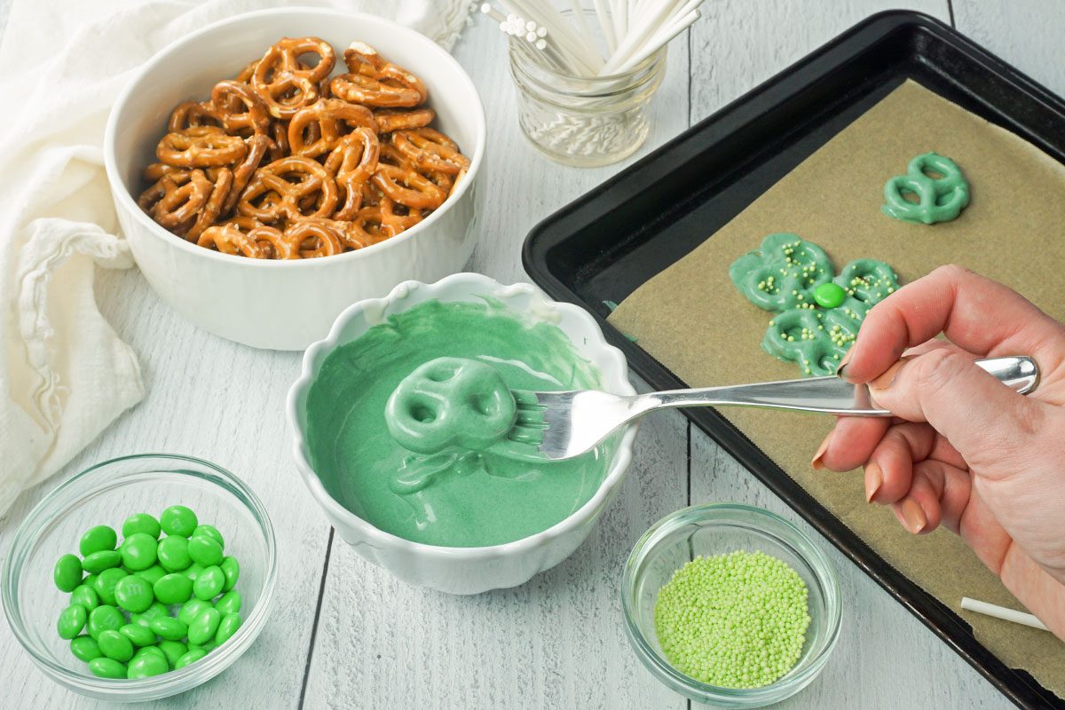 A female making shamrock pretzels