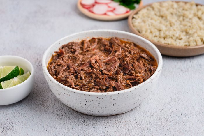 Slow Cooker Barbacoa is ready and served in plate