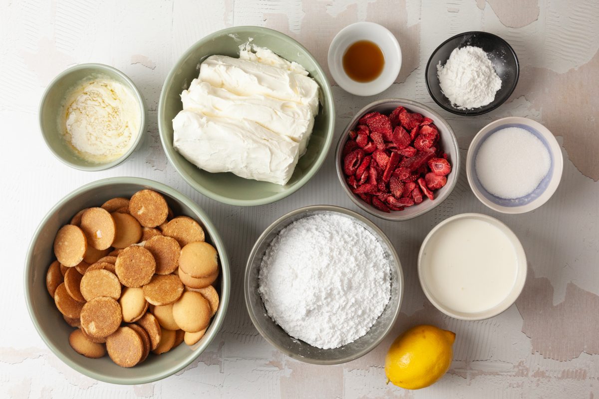 cream cheese, strawberries, sugar, whipping cream, vanilla wafers and crumbs for crust in separate bowls