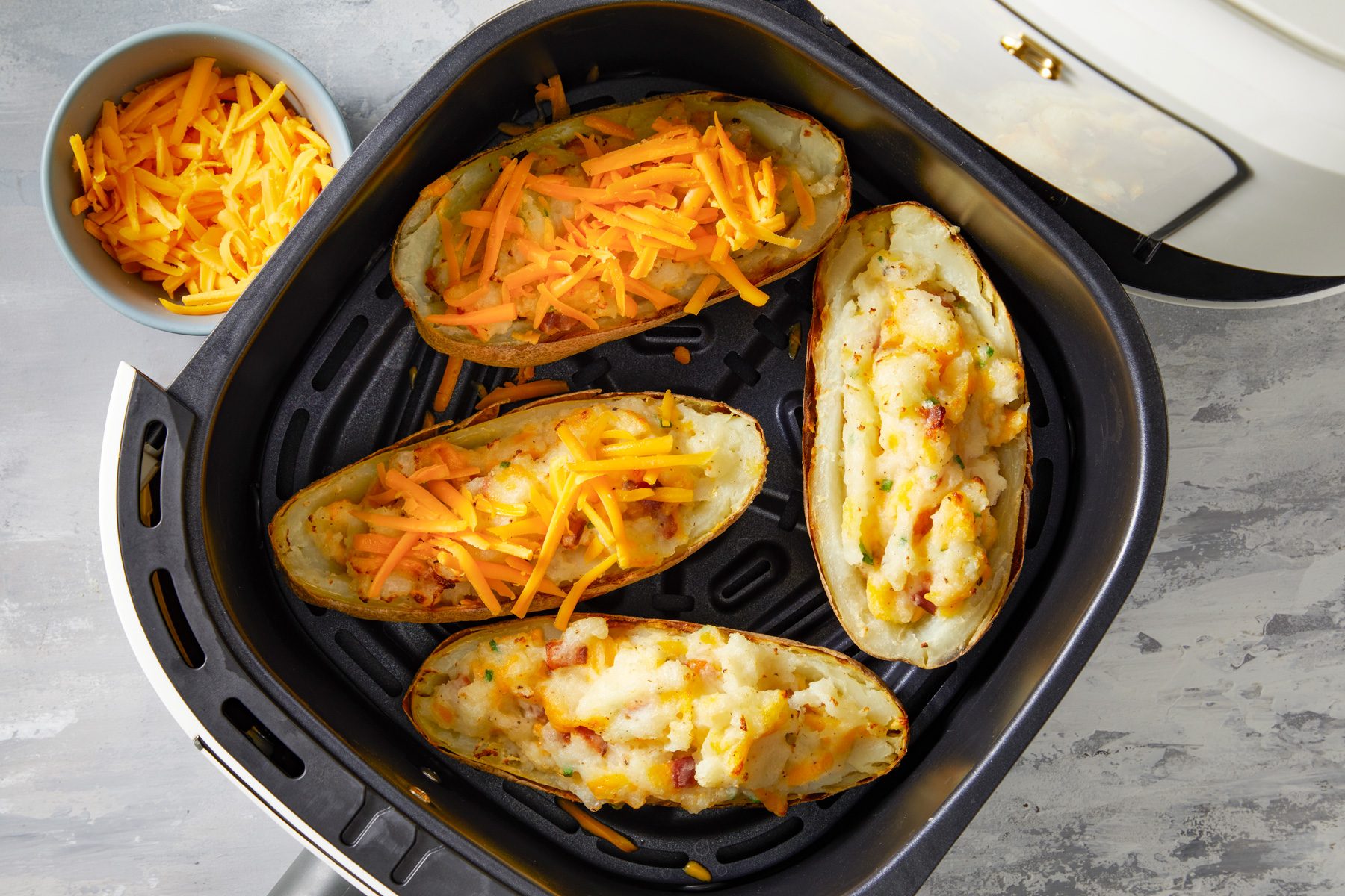 Spoon into potato shells. Cook