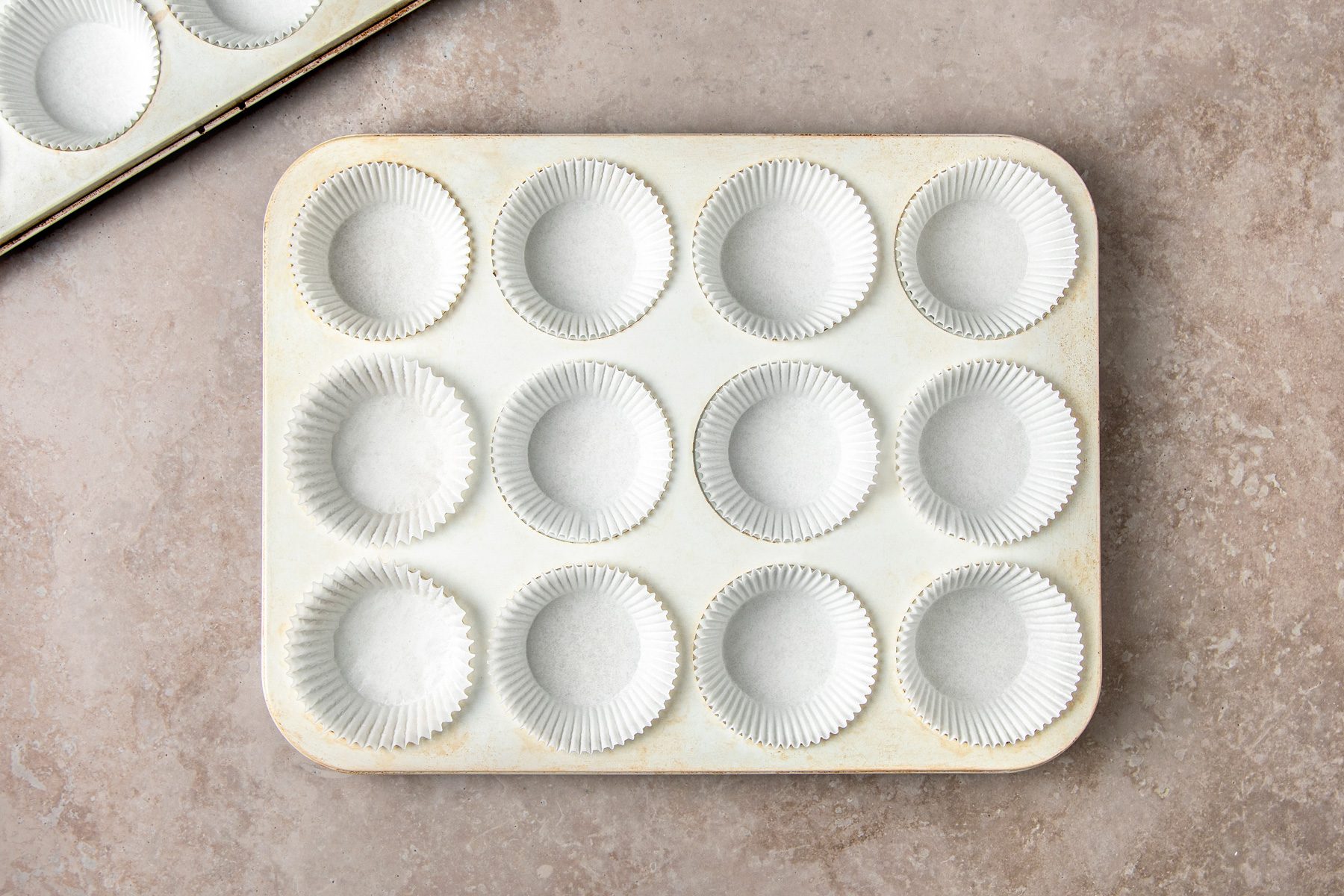 Line 16 muffin tin wells with paper liners or grease with cooking spray