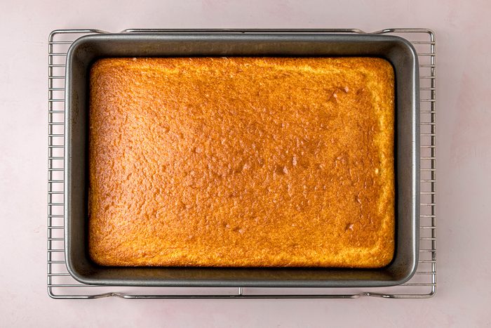 overhead shot of baked cake on a wired rack