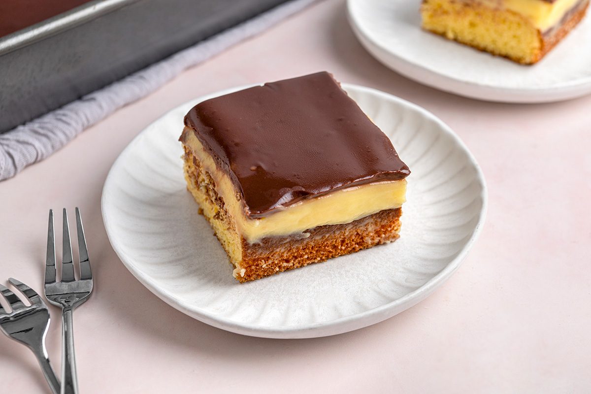 close up shot of Boston Cream Poke Cake