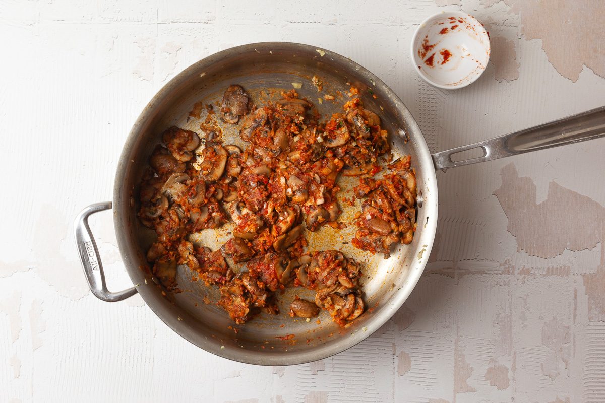 light brown onion and mushroom mixture in a pan