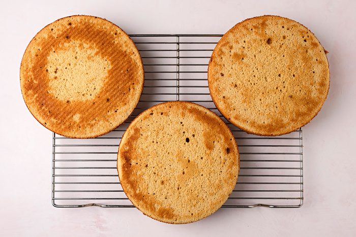Baked cake cooled on a wired rack.