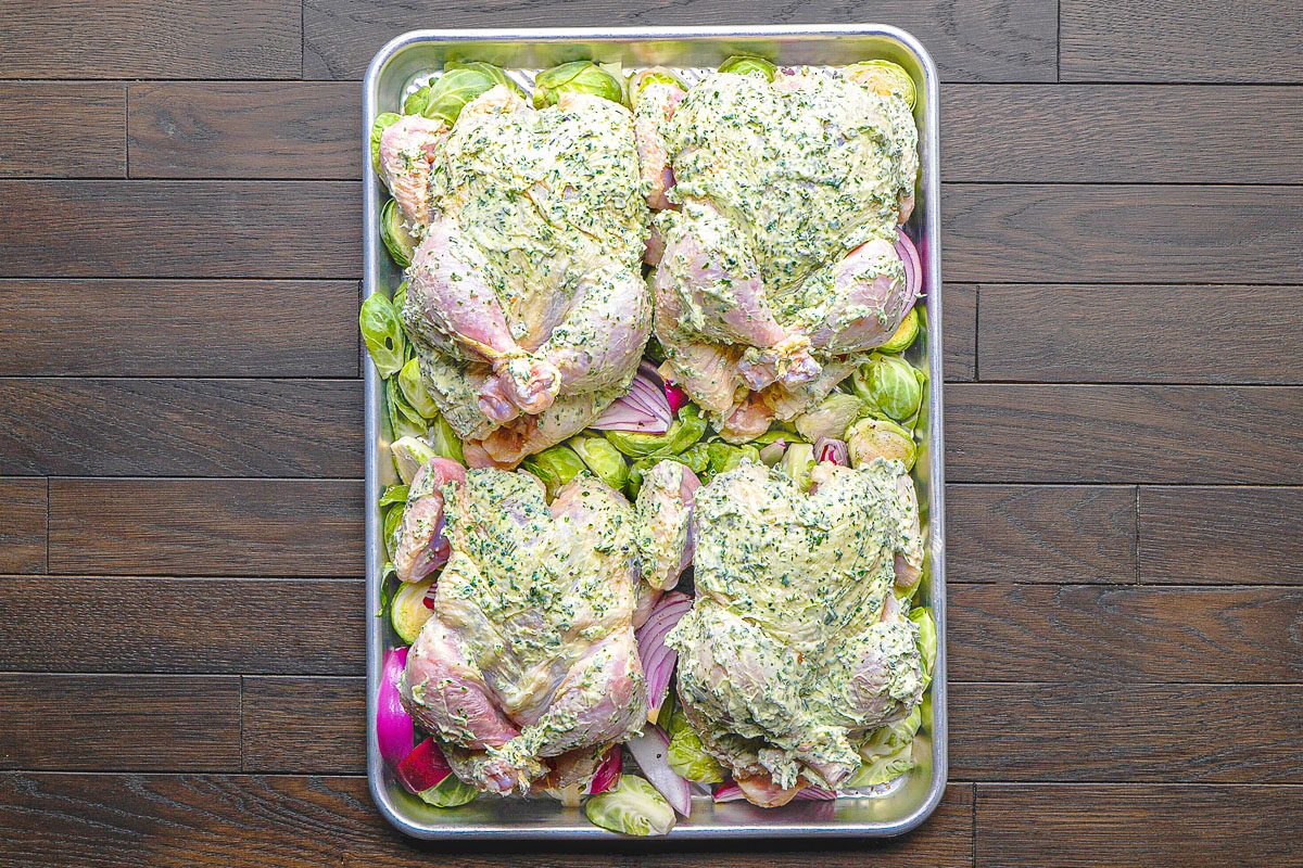 hens placed breast side up, on top of the vegetables