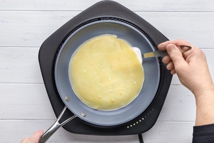Crepe Cake being cooked on a pan.
