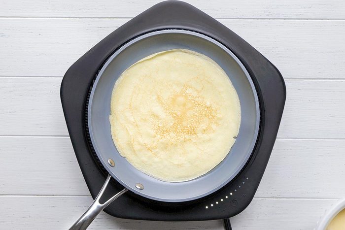 Crepe Cake being cooked on a pan.