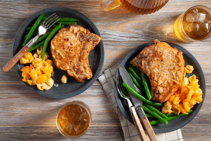 Fried Pork Chops on a wooden background